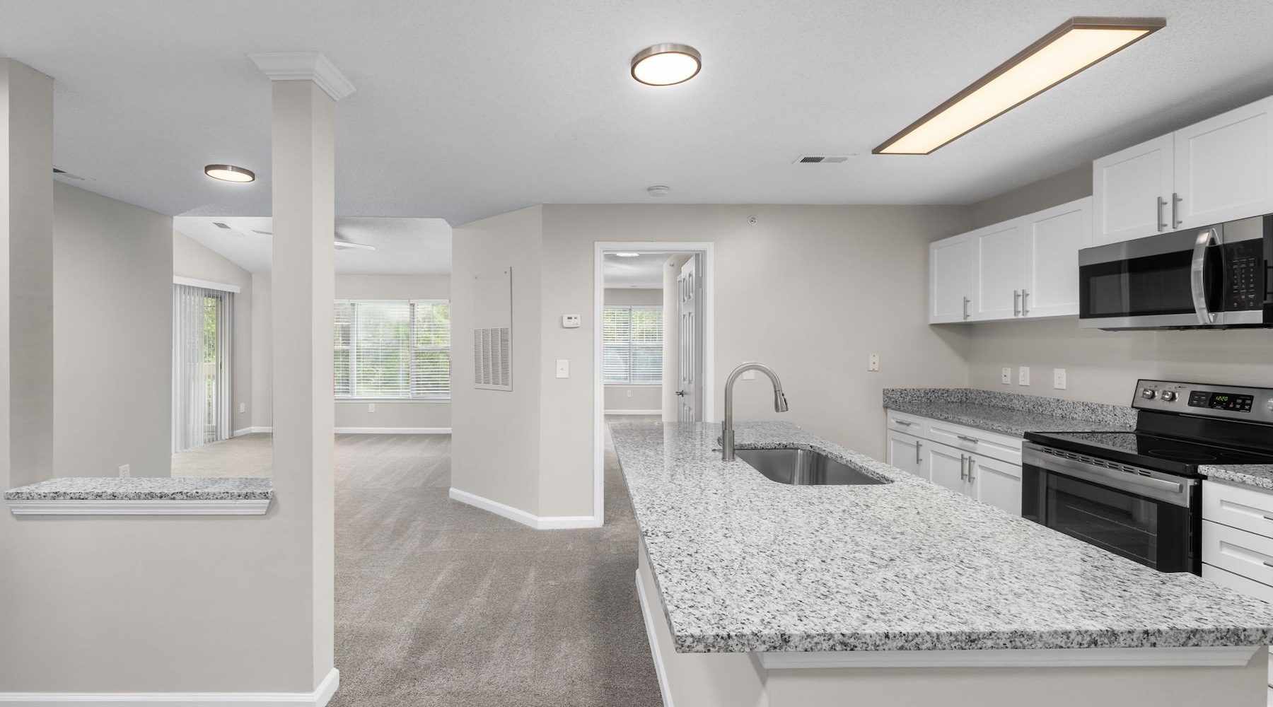 Beautiful living areas to match your lifestyle a kitchen with white cabinets