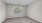 a room with a window and a carpet