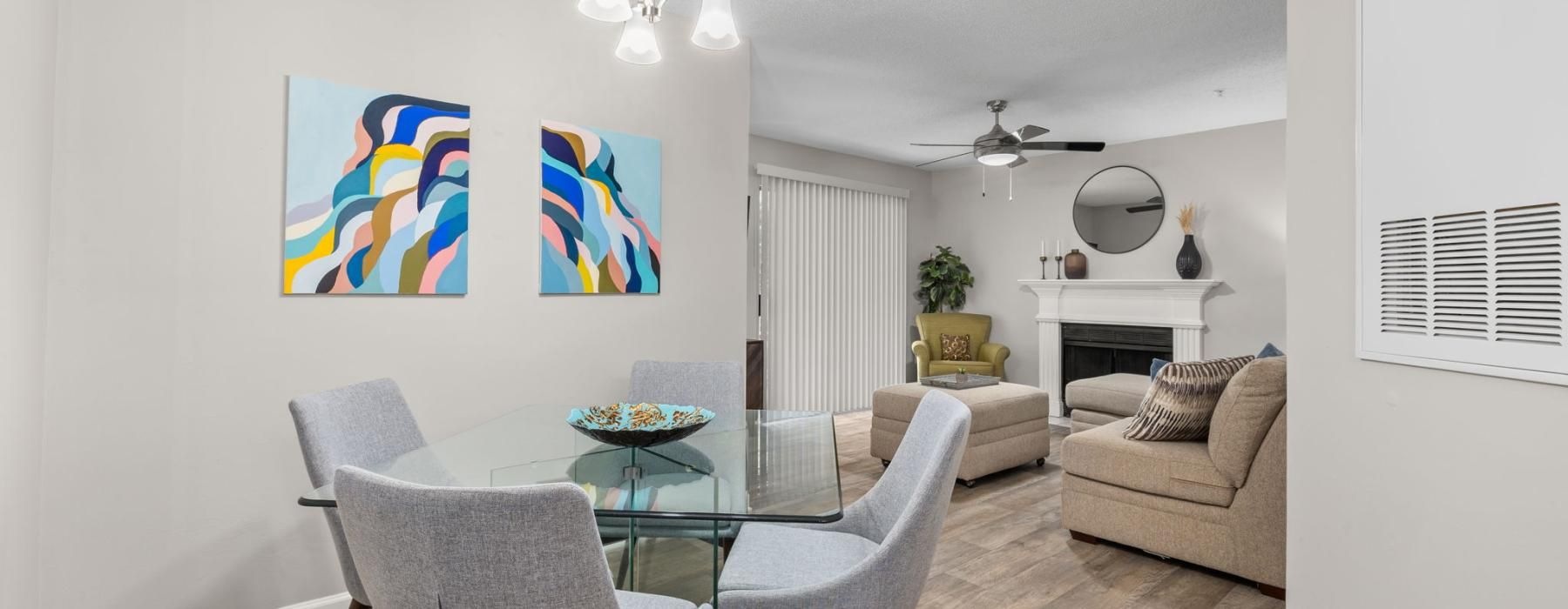 a living room with a table and chairs
