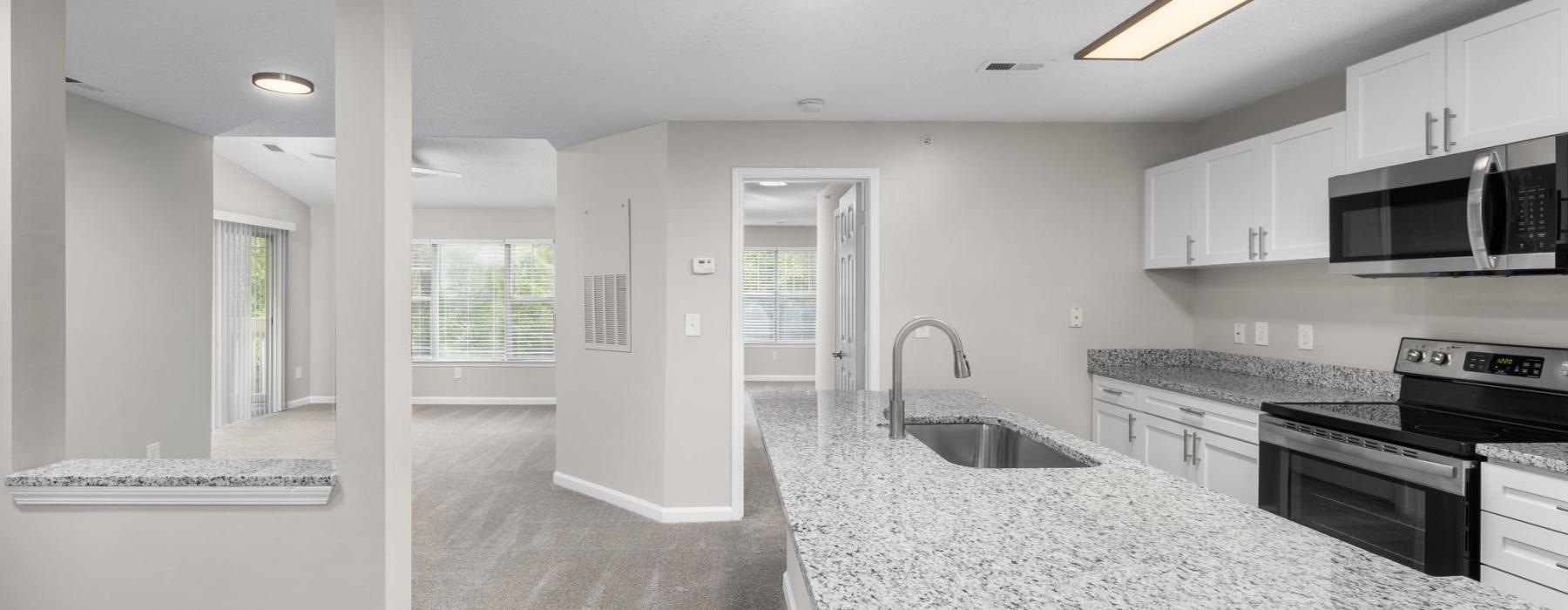 a kitchen with white cabinets